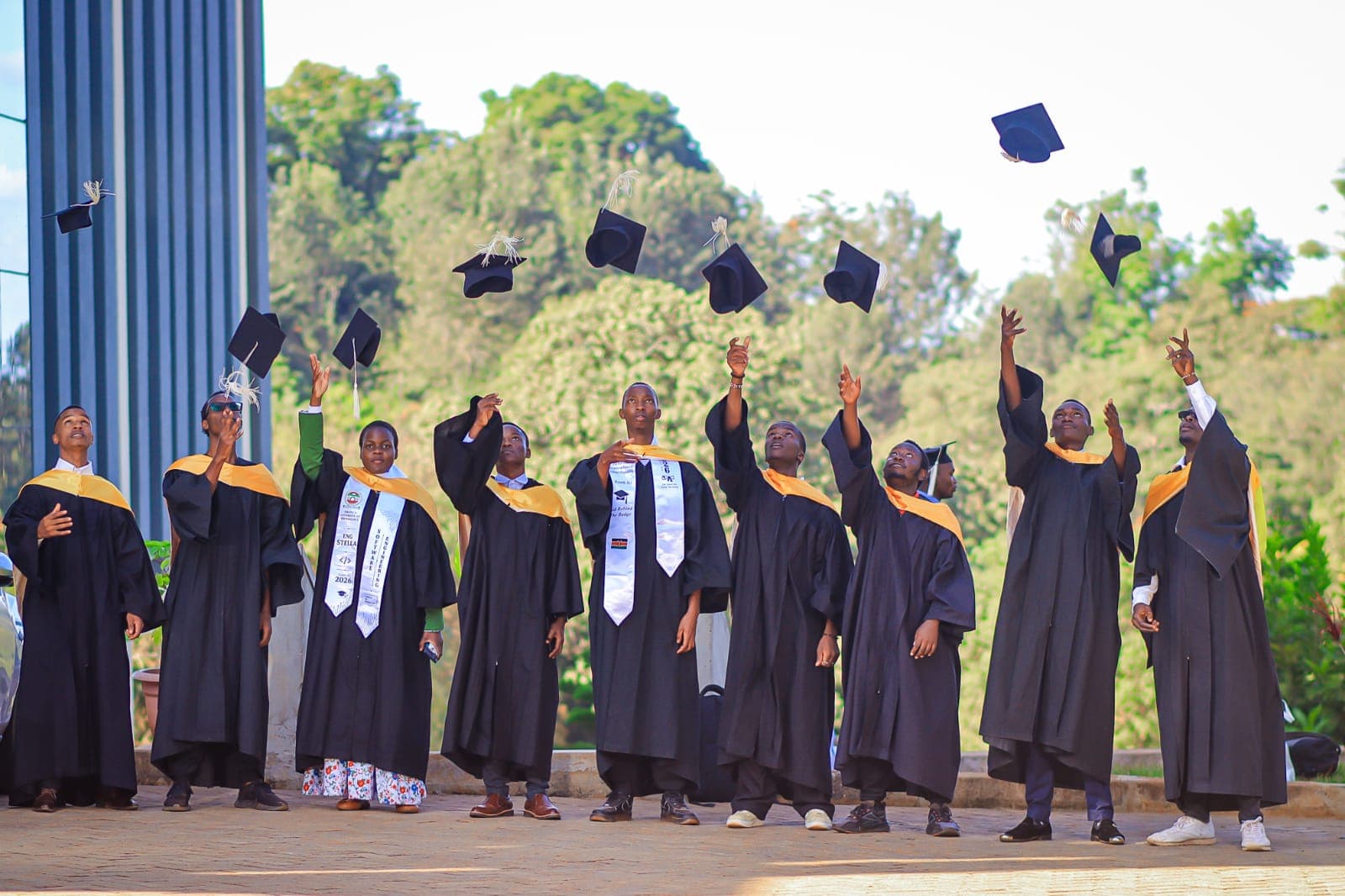 Cap throwing celebration on campus grounds